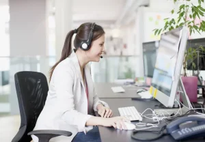 healthcare IT tech working on her computer