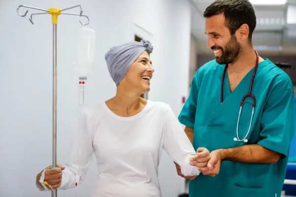 patient care tech helping old lady walk