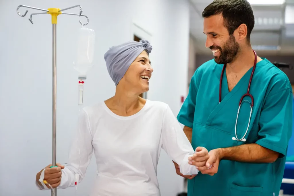 patient care tech helping old lady walk