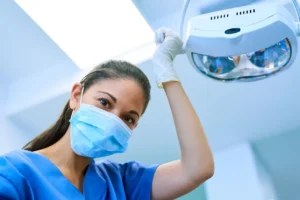 dental assistant smiling behind mask